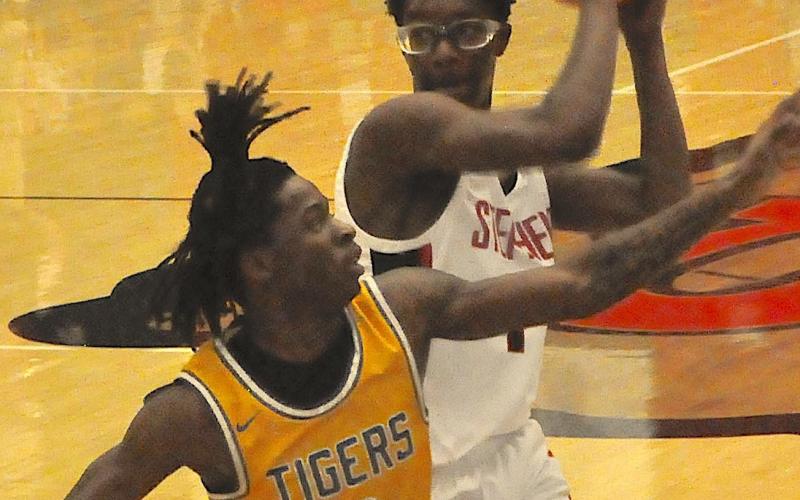 Indian guard Jayden Haynie muscles past a defender to get off a shot during last week’s basketball contest with Washington-Wilkes.
