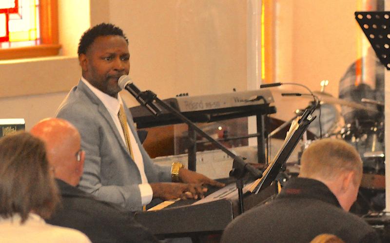 Trinity CME Church Elder Charles Thompson leads the congregation at a Dr. Martin Luther King, Jr., celebration on Monday, Jan. 19, in song and worship.