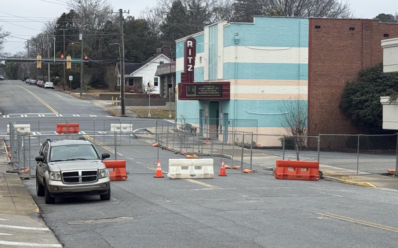 Work on a $3 million expansion project at the Ritz Theatre in downtown Toccoa has begun, as indicated by a portion of Doyle Street being fenced off to be used as a staging area for construction materials.