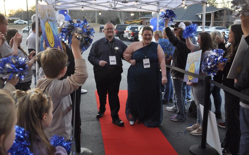 Clyde Williams, left, was one of the more than 100 Kings and Queens who attended the third annual Night to Shine event hosted by Ebenezer Baptist Church in Toccoa on Friday night, Feb. 13. His chaperone, known as a “buddy,” was Karli Cobb, right.