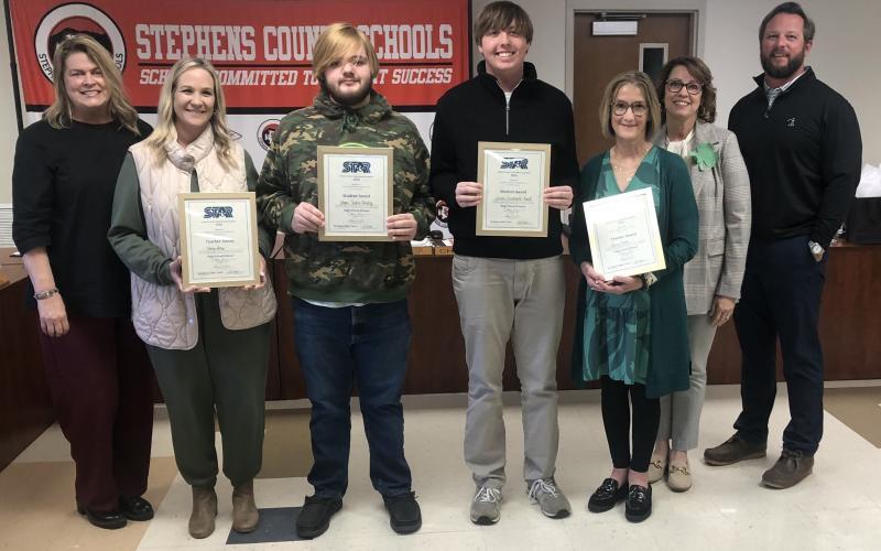On Tuesday night, March 17, the Stephens County Board of Education honored the high school’s two STAR students and teachers.The STAR students are Logan Shirley and Landon Powell, while the STAR teachers are Kasey Ivey and Lynne Fisher. Shirley and Powell got the same SAT score. They were joined by, from left to right, Toccoa-Stephens County Chamber of Commerce President Julie Paysen, superintendent Connie Franklin, and Board of Education chair Tripp Arrowood.