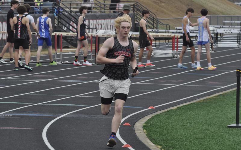Garrett Krous races around the track at Stephens County High School during the Currahee Relays on Saturday, March 7.