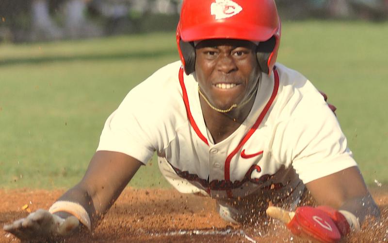 Carmelo Renfroe slides into home during Friday’s game against Hart County.