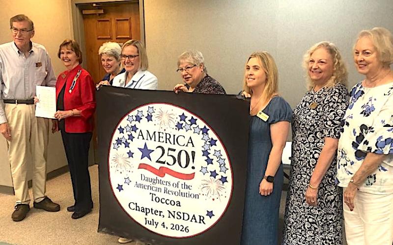The Toccoa City Commission on Monday approved a proclamation recognizing the work of the local chapter of the Daughters of American Revolution (DAR) in promoting the upcoming 250th birthday of the United States of America. Toccoa Mayor Evan Hellenga, on the left end, presented the proclamation to DAR members in attendance at Monday’s meeting.