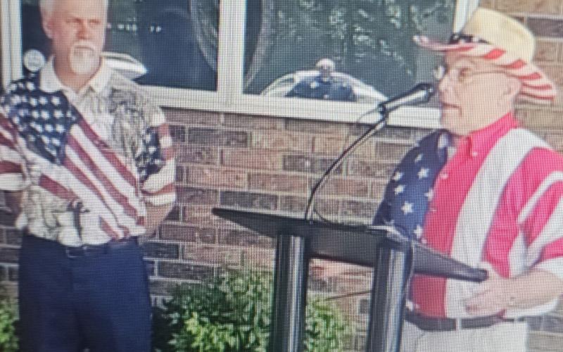 Stacey Simmons, left, and Roy English, right, participated in the Toccoa Elks Lodge's Flag Day ceremony on June 14.
