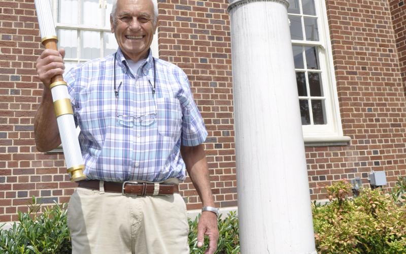 William Tucker was one of the 17 individuals selected to carry a torch during the 1996 Summer Olympics, which were held in Atlanta July 19 through Aug. 4, 1996. On Tuesday, he was photographed standing next to the eternal flame statue in front of Toccoa City Hall.