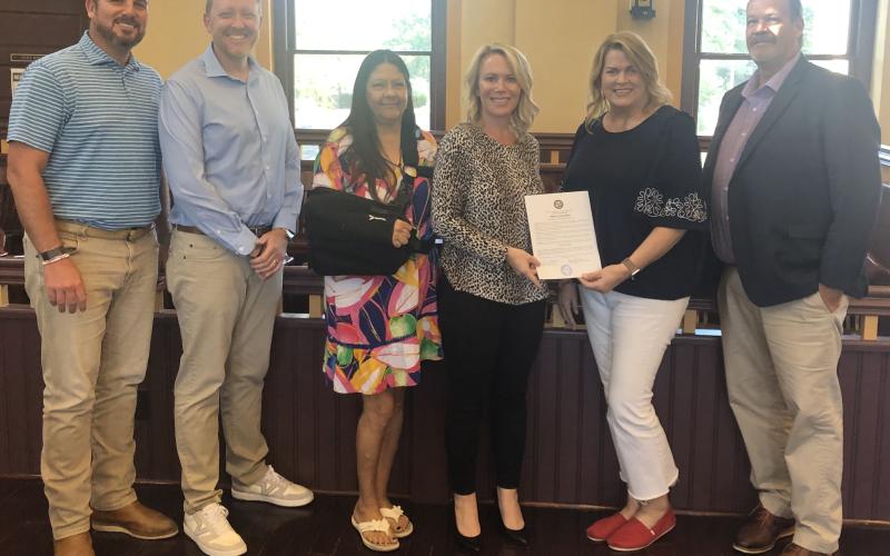 The Stephens County Board of Commissioners honored former Chamber of Commerce president Julie Paysen at its meeting on Tuesday night for her work. She was the president of the Chamber for 11 years. Pictured are BOC chair Chris Rickman, BOC vice chair Craig Oglesby, commissioner Debbie Whitlock, commissioner Tara Simmons, Paysen, and commissioner Chuck Wright.