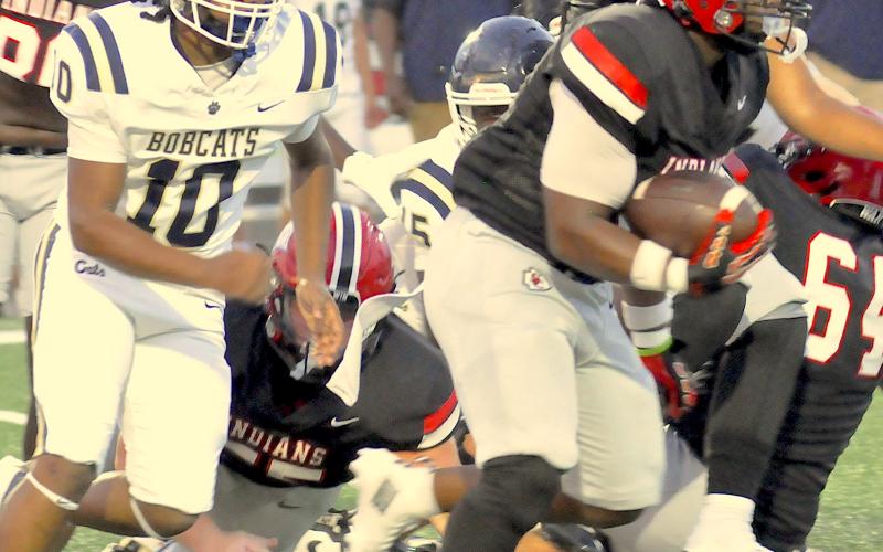 Running back Jasian Wiley looks for room against Seneca.