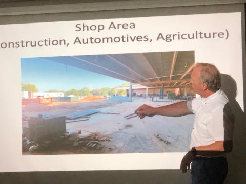  School superintendent Bryan Dorsey shows school board members the ongoing work that’s underway at the high school, an area into which automotive, construction and agriculture classes will move.