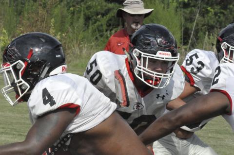 Lineman William Rudeseal (50) mixes it up during a recent practice session drill. Rudeseal and his teammates will have a pre-season scrimmage with White County this evening.