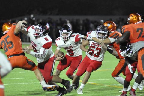Hudson Spurlock runs between blockers 