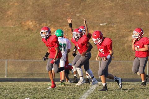 Jasec Smith celebrates historic field goal with Stephens County Middle school teammates - Courtesy of   David Byargeon