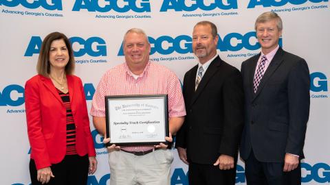 Stephens County commissioner Dennis Bell (second from left) recently received the economic and community development specialty track from the ACCG’s Lifelong Learning Academy.