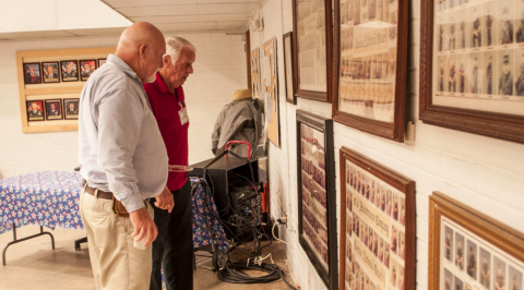 ‘Old Guard’ members Nicky Willis and Benny Cheek check the National Guard photos from the 1980s.