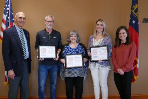 Stephens County graduates at the Oct. 29 ceremony included Jason Scott, Mary Smith and Samantha Rickman. They are pictured with Carrie Barnes of Georgia EMC (right) and Rope Roberts of Georgia Power Company (left).