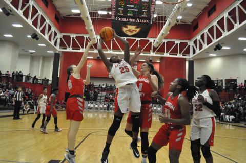 Ranajah Verdell grabs a rebound against Madison County  