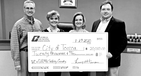 Exhibiting one of the giant GMA checks are (from left) city manager Billy Morse, city human resources director  Jan Crawford, GMA representative Brenda Eckman and Toccoa Mayor Terry Carter.