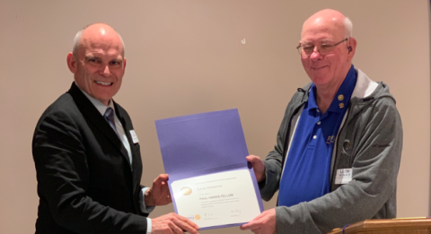Leon Osborne (left) receives the Paul Harris Fellow designation from Toccoa Rotary Club president Leon Womack (right).