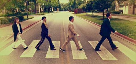 Members of Abbey Road Live! restage the iconic Beatles album cover photograph.