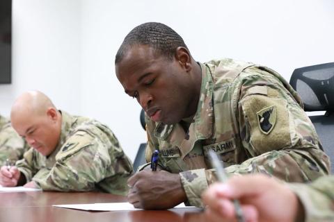 Army Spec. Isaac Swilling (right) concentrates on a test during a recent soldier of the year competition. Swilling is based at Andersen Air Force Base in Guam. He’s the son of former SCHS standout Ken Swilling.