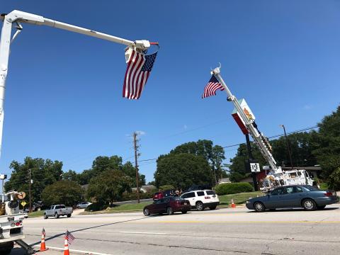 This was the scene Tuesday afternoon on Big A Road – large American flags draped across the roadway in honor of the late Stan Elrod.