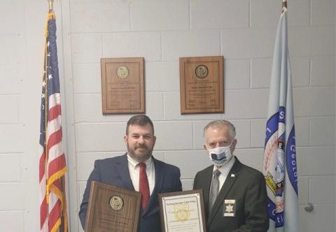 Stephens County Sheriff’s Office certification manager Lt. Stephen Stewart (left) and sheriff Randy Shirley display recertification plaques.