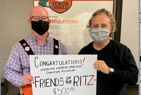 Wesley Copelan (left) of Home Depot and Friends of the Ritz president Gary Cortellino (right) celebrate the $500 Home Depot Operation Surprise grant.