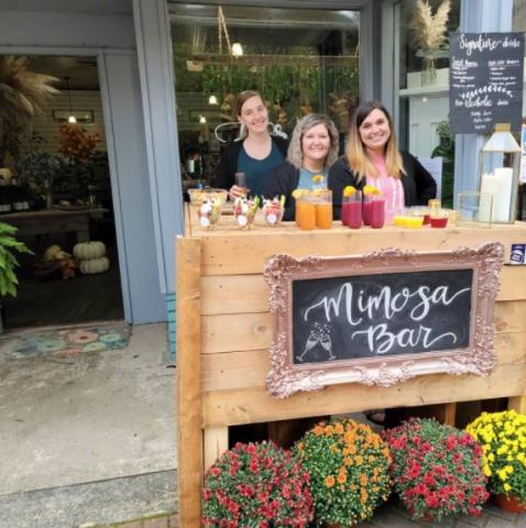 Here’s a scene from last year’s Sip-n-Stroll in downtown – Downtown Flowers hosting a Mimosa Bar.