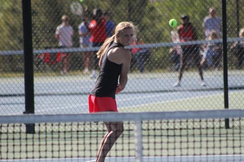Stephens County No. 1 singles player Madison Rogers loads up for a backhand stroke during Monday’s first round state playoff action against Murray County.