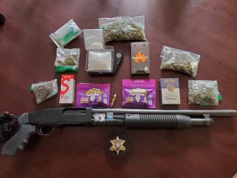 These are some of the items deputies seized during an arrest early Monday. They include suspected drugs and paraphernalia as well as a shotgun.