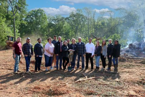 Shepherd’s Hill Academy staff gathered in April  for the groundbreaking ceremony for the academy’s new multi-purpose dining hall. Pictured in the center are academy founders Trace and Beth Embry. 