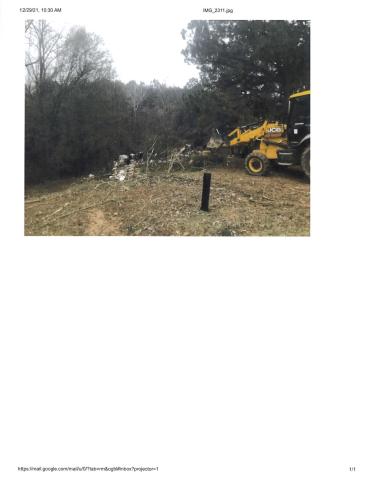 Heavy machinery was used to remove ramshackle temporary housing in areas off Stephens Circle and Stephens Extension.