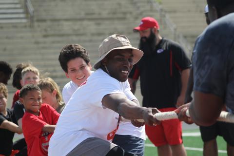 A.J. Howard playing tug of war during a football camp at Stephens County 