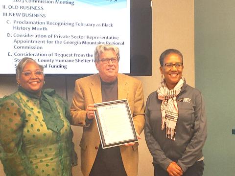 Toccoa Mayor David Austin (center) presents the Black History Month proclamation to Shantelle Grant (left) and Marie Cochran (right).