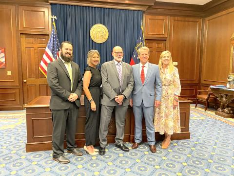 tephens County elections supervisor Bruce Carlisle (center) was appointed to the board of corrections by Gov. Brian Kemp. Pictured, with Carlisle, left to right, are county deputy elections supervisor Isaac Overstreet, Carlisle’s daughter Jennifer Steele, Kemp, and Georgia first lady Marty Kemp.