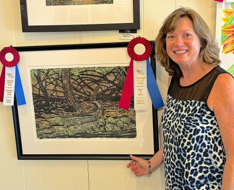 Gail Watson shows off her work entered in the Currahee Artist’s Guild  fall show. She won Exhibitor’s Choice and Best in Show.