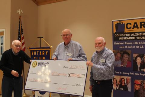 The Toccoa Rotary Club presented Warren Johnston, right, a check for $1,000 for Camp Toccoa at Currahee.