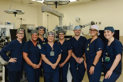 The operating room team at Northeast Georgia Medical Center Gainesville poses for a photo before completing the state of Georgia's first histotripsy procedure on Friday, April 19, 2024. From L-R: Caroline Chotas, RN; Kristy Foutty, CST; Casey Patton, RN, CNOR; Stephanie Sullins, CST; Shannon Sutton, RN, CNOR; Nelson Royall, MD; Ambar Riffi Temsamani, PA-C; Cierra Triggs, CST.