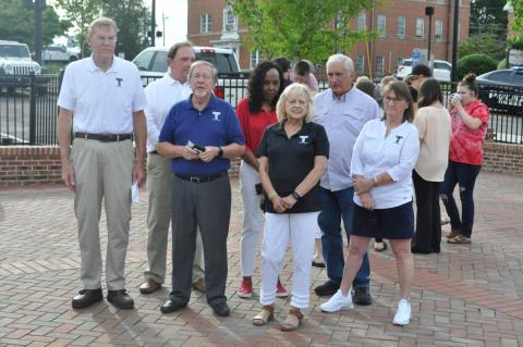 Pictured, left to right,are city commissioners Evan Hellenga, Terry Carter, Ron Matheson, city manager Fredda Wheeler, mayor Gail Fry, Rev. Paul Garrison and commissioner Michelle Jamieson.