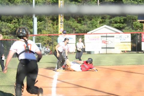 Senior Carson Stowe sliding into third during the first game in the Hart double header last week.