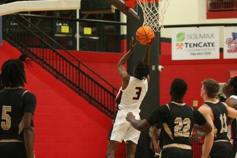 CJ Harbin jumps to put the ball through the hoop in a recent game at Currahee Arena.