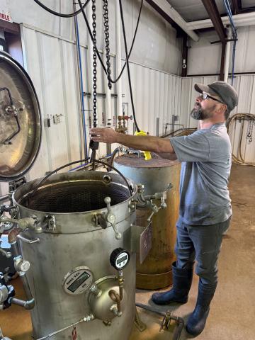 Richard Johnson working on canning at the Eastanollee Cannery.
