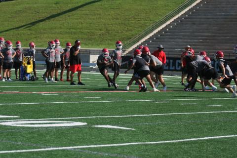 The Indians high school football team is hard at work finishing off the month of June practices this week before enjoying an off week next week. The Indians will resume practice on July 7. Pictured below are the Indians running through drills during their early morning practice. They will start workouts in full pads in July. Photo by Laura Shaw.