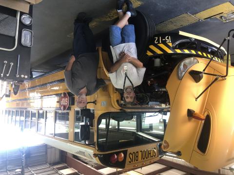 Shop workers at Stephens County High School have been battling the heat to get school buses ready for the start of the school year tomorrow. Pictured are technician Bruce Watts, left, and shop supervisor Brian Pulliam, right. Photo by J. Todd Truelove