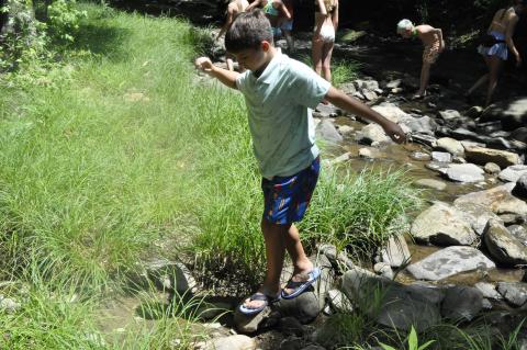 On Monday afternoon, children played in Toccoa Creek as part of their summer camp activities at Camp Mikell. Photo by Michael O’Hearn