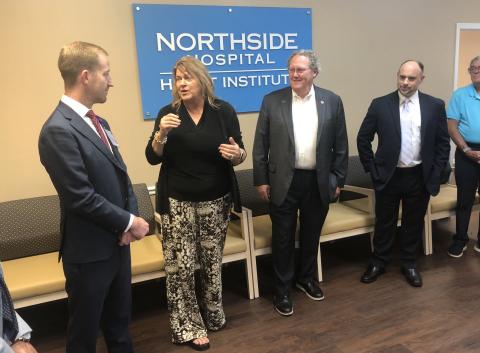 Stephens County Chamber of Commerce President Julie Paysen, second from left, talks to Stephens County Hospital CEO Van Loskoski about the new cardiology services provided by Northside Hospital Heart Institute in Toccoa as Northside Hospital cardiovascular Dr. Jeffrey Marshall and local Northside/Stephens County Dr. Mark Matthews listen to their remarks. J. Todd Truelove/The Toccoa Record