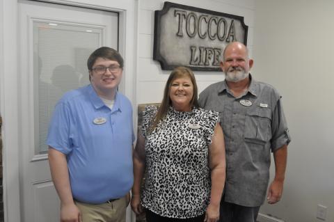 The Toccoa Family Life Resource Center has opened a new headquarters. This is the first time in the organization’s 40 year history that it has had a permanent building in town. Pictured are Toccoa Family Life Center Executive Director William Brothers, his wife, Amanda, and the facility’s office manager, Jarrett. Michael O’Hearn/The Toccoa Record