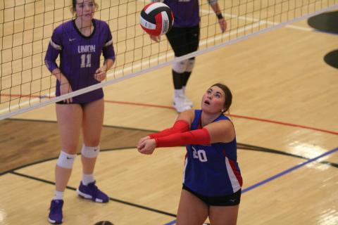Mallie Kate Underwood sets the ball during one of the home volleyball matches last week.