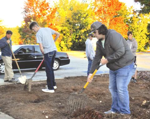 Camden Gibbs joined other Stephens County High School agricultural education students in preparing a monarch butterfly garden spot at the Toccoa-Stephens County Chamber of Commerce.