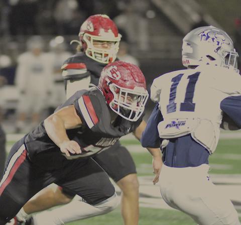 Indian offensive lineman Conner Holtzclaw (77) has an East Jackson player squarely in his target area.